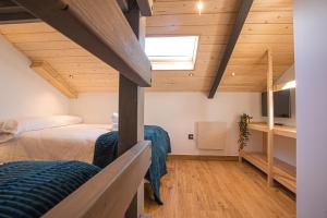 Posteľ alebo postele v izbe v ubytovaní APARTAMENTO BLOSSOM