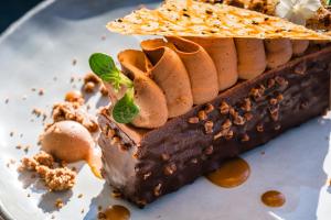 a dessert on a plate with a chocolate dessert at Atlantic Hôtel & Spa in Les Sables-d'Olonne