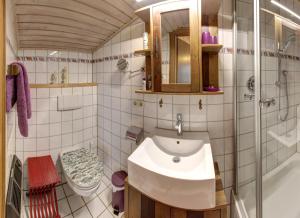 a bathroom with a sink and a toilet at Gästehaus Barbara Schwaiger in Inzell +51 photos
