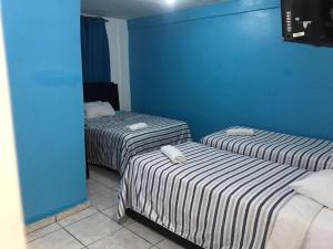 Postel nebo postele na pokoji v ubytování Hostal Magisterial Santo Domingo