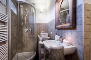 a bathroom with a sink and a shower and a toilet at Como Unique View - byMyHomeinComo in Como
