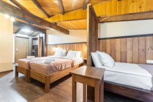 Postel nebo postele na pokoji v ubytování Hotel Mansarda Mestia