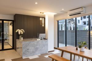 a lobby with a reception desk in a building at AMIRI PLACE HOTEL in Chiang Mai