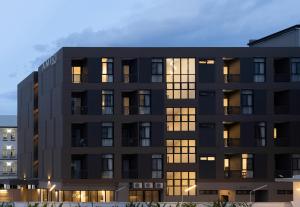 an exterior view of a black building at AMIRI PLACE HOTEL in Chiang Mai