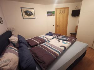Postel nebo postele na pokoji v ubytování Ferienwohnung Aquileia