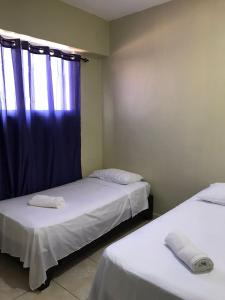 Postel nebo postele na pokoji v ubytování Hostal Magisterial Santo Domingo