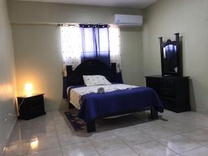 Postel nebo postele na pokoji v ubytování Hostal Magisterial Santo Domingo