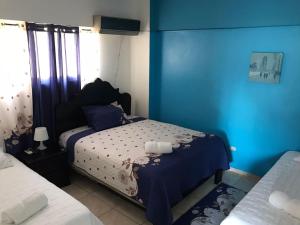 Postel nebo postele na pokoji v ubytování Hostal Magisterial Santo Domingo