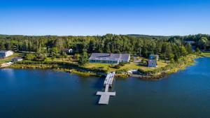 an island with a cross in the middle of a lake at OCEAN BAY VIEW Luxury Guesthouse in Musquodoboit Harbour
