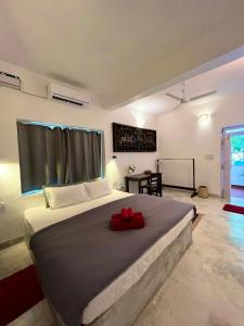 מיטה או מיטות בחדר ב-Namaste Jungle - A Boutique Homestay