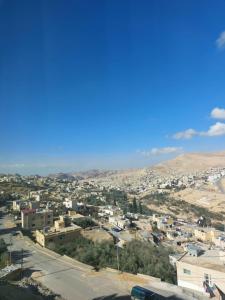 a view of a city with mountains in the background at Magic view apartment in Wadi Musa