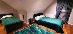 Postel nebo postele na pokoji v ubytování Apartamenty Green&Blue w Węgorzewie- GREEN