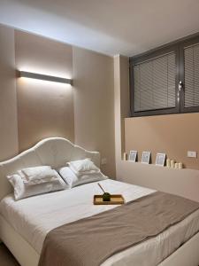 A bed or beds in a room at Fiera Milano City Apartment