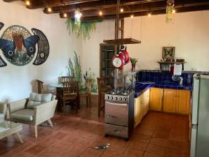 a kitchen with a stove top oven in a room at Tesoro Escondido Ecolodge Cabinas in Bocas del Toro