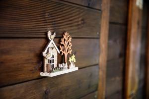 a small house decoration on a wooden wall at Garden house in Neapolis