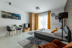 Posedenie v ubytovaní Apartament Ażurowy + 8 fotografií