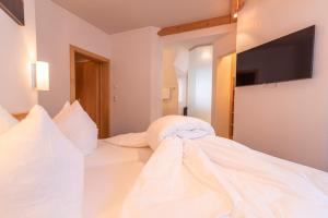 Posteľ alebo postele v izbe v ubytovaní Hotel Garni Martina