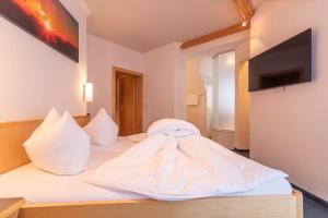 Posteľ alebo postele v izbe v ubytovaní Hotel Garni Martina