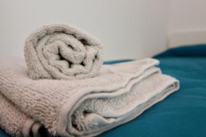 A bed or beds in a room at Modern Balcony Apartment with free Parking