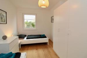 A bed or beds in a room at Modern Balcony Apartment with free Parking