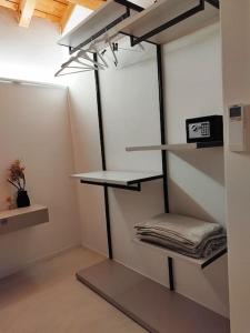 a room with shelves and a room with avertisement at Una Rosa sul Mincio in Valeggio sul Mincio