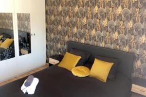 Łóżko lub łóżka w pokoju w obiekcie La Petite Escapade