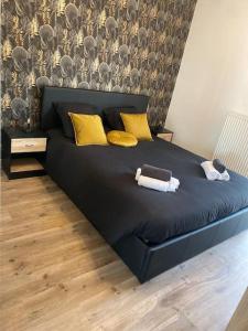 Łóżko lub łóżka w pokoju w obiekcie La Petite Escapade