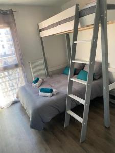 Łóżko lub łóżka w pokoju w obiekcie La Petite Escapade