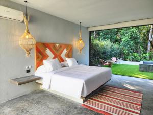 Voodi või voodid majutusasutuse Hotel Piedra Mulata - Adults Only toas