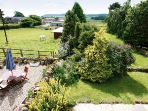 an aerial view of a garden with a horse in a field at The Cottage in Cloughton