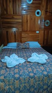 Postel nebo postele na pokoji v ubytování Monteverde Monkey Hostel