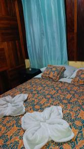 Postel nebo postele na pokoji v ubytování Monteverde Monkey Hostel