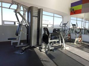 a gym with several treadmills and cardio machines at Roma Guadalajara in downtown in Guadalajara
