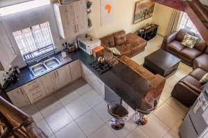an overhead view of a kitchen and living room at 515 on Warthog by the River in Marloth Park