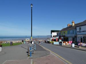 a street with people walking on the beach at Granary Cottage - E5634 in Warkleigh