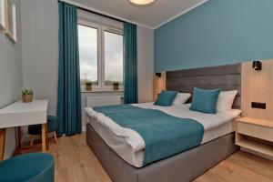 Llit o llits en una habitació de Apartament Zatoka 19