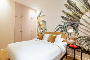 Postel nebo postele na pokoji v ubytování HolidaysInParis - Bonne Nouvelle