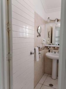 a bathroom with a sink and a mirror at Villas del Palmar Manzanillo with Beach Club in Manzanillo