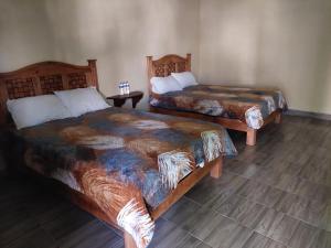 Postel nebo postele na pokoji v ubytování Hotel Villa Aurora
