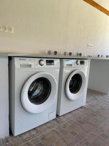 two washing machines sitting next to each other in a room at Bella Mare Villa Sithonia in Akti Salonikiou