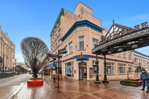 a city street with buildings and a bridge at The Bedford Regency Hotel in Victoria