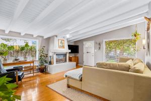 a living room with a couch and a fireplace at Casa Mesa in Santa Barbara