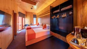 a hotel room with two beds and a television at Iron Creek Bay Estate in Sorell