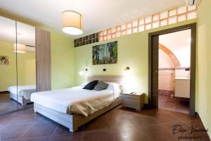 A bed or beds in a room at Camera il Nido