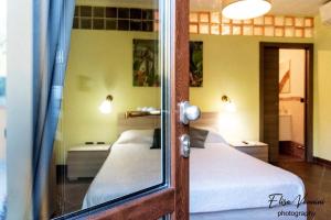 A bed or beds in a room at Camera il Nido