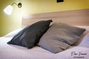 A bed or beds in a room at Camera il Nido