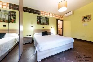 A bed or beds in a room at Camera il Nido