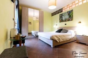 A bed or beds in a room at Camera il Nido