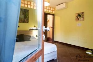 A bed or beds in a room at Camera il Nido