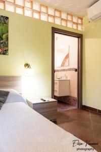 A bed or beds in a room at Camera il Nido